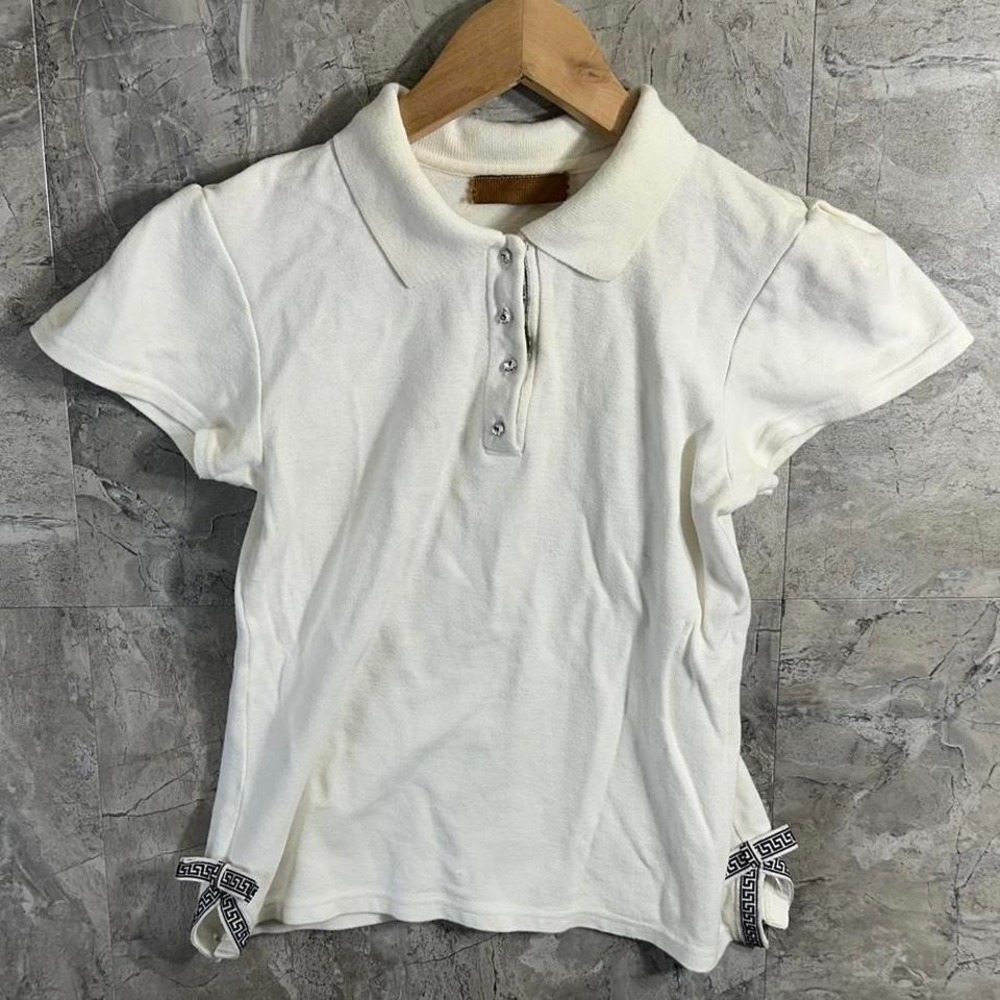 Vintage white polo shirt with diamond buttons and cute bows .‎ Woman's Size M